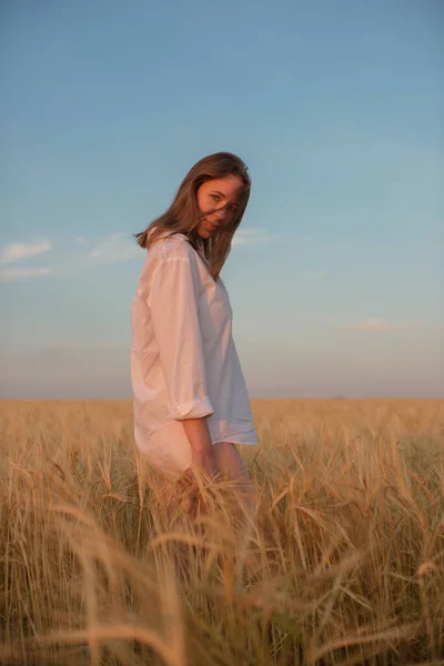 Aerial view of woman lying in the field of wheat — Stock Photo, Image