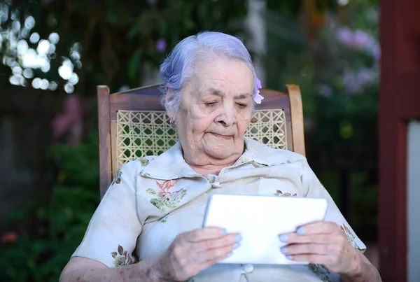 Grandma with tablet — Stock Photo, Image