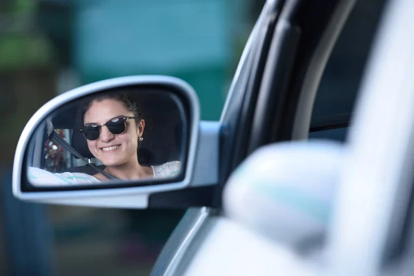 Girl driving reflection on mirror — Stock Photo, Image