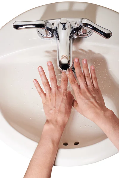 Isolated hand washing in sink — Stock Photo, Image