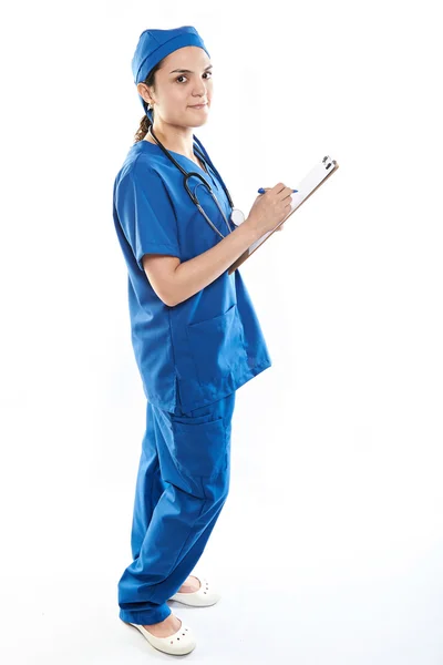 Enfermeira escrever no clipe de papel — Fotografia de Stock