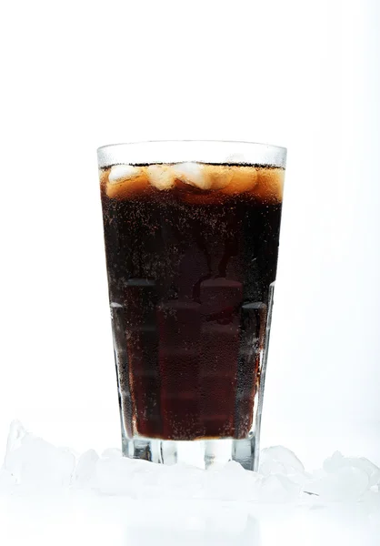 Glass with soda in ice — Stock Photo, Image