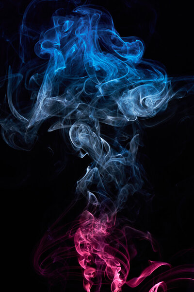 Curly coloured cloud of smoke isolated on black