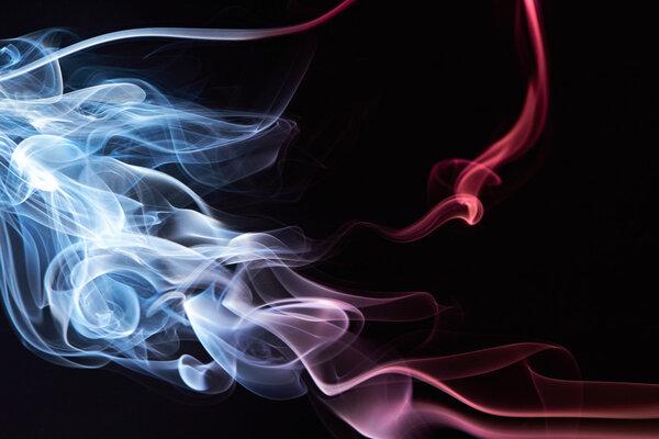 Colourful smooth smoke as frame isolated on black