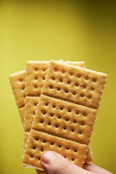 Hand hold crackers — Stock Photo, Image