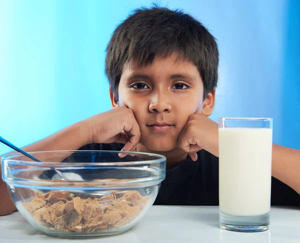 Bored boy on breakfast — Stock Photo, Image