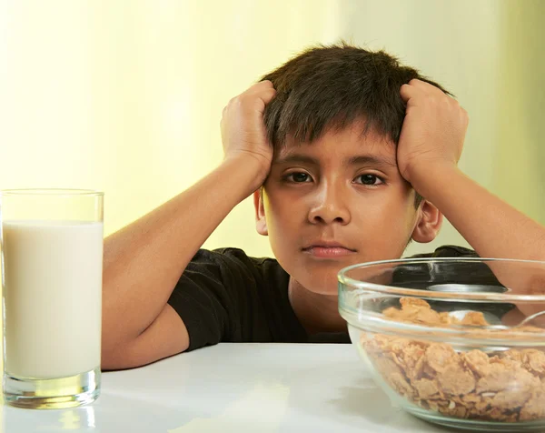 Boy on breakfast table — Stock Photo, Image