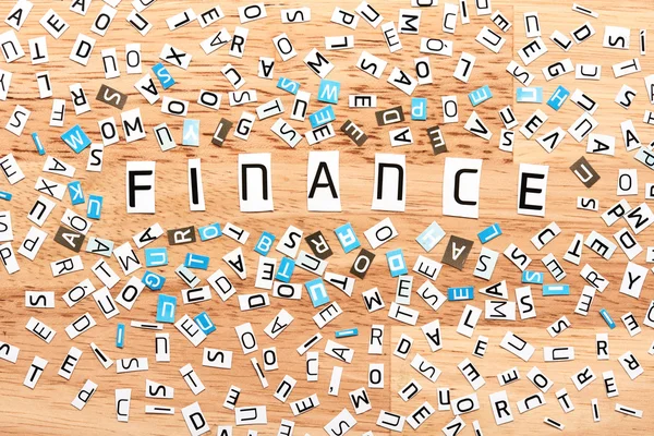 Finance word from cut out letters — Stock Photo, Image