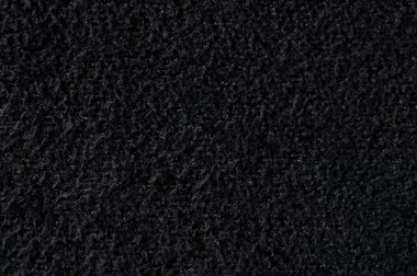 Siyah yumuşak malzeme arkaplan makro yakın görünüm yüzeyi