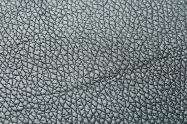 Bulanık arka plan makrosu olan gri deri yüzey yakın görünüm