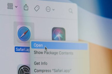 New york, USA - April 19, 2021: Click and open safari app on laptop screen macro close up view