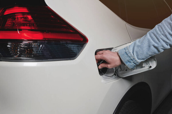 Refill car gas tank theme. Hand open or close vehicle fuel tank