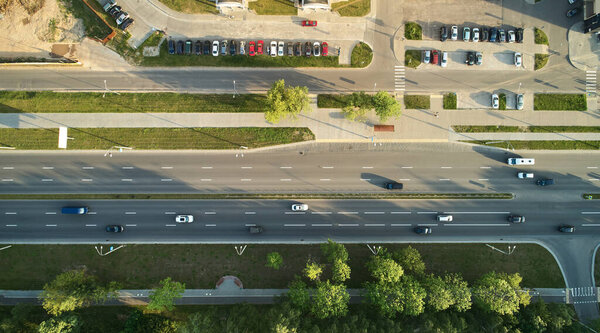 Traffic on city road above top drone view. Ground transport theme