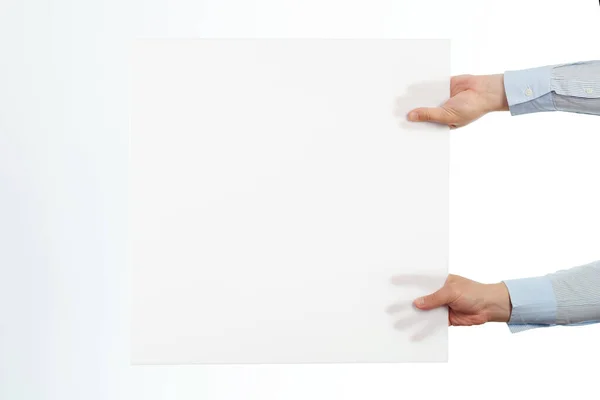 Mãos Segurar Cartaz Quadrado Branco Isolado Fundo Estúdio Branco — Fotografia de Stock