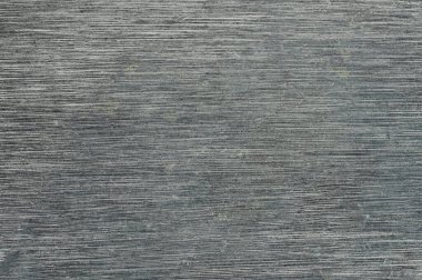 İnce çizgiler ve desenler içeren desenli gri yüzeyi yakından görmek eşsiz bir görsel efekt yaratır..