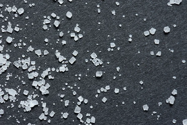 Sugar crystals on black — Stock Photo, Image