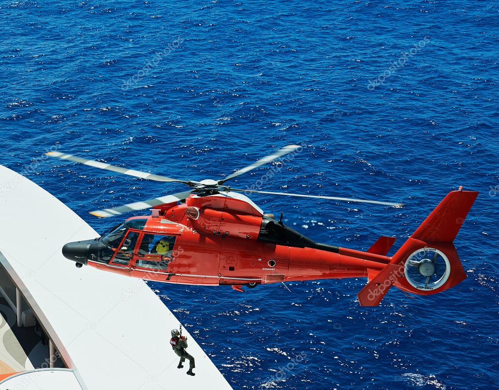 lifeguard descend from helicopter