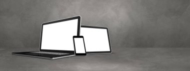 Beton ofis sahnesinde dizüstü bilgisayar, cep telefonu ve dijital tablet bilgisayar. Afiş arka planı. 3B Görüntü