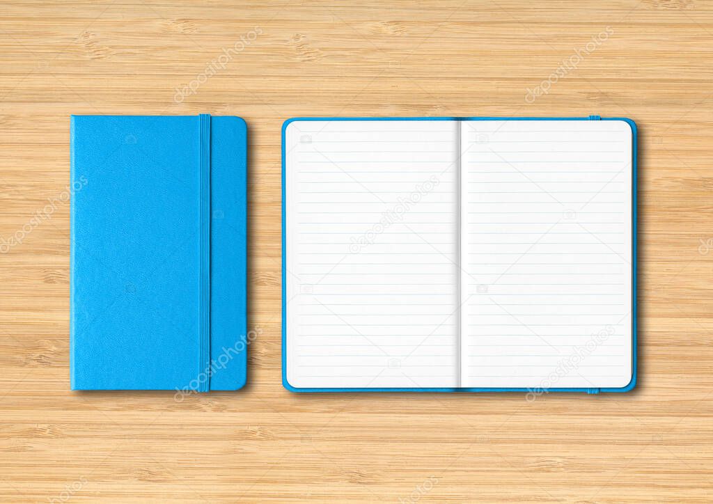 Blue closed and open lined notebooks mockup isolated on wooden background