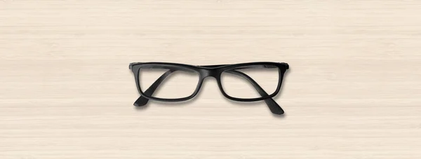 白い木製の背景バナーに隔離された黒い目のメガネ — ストック写真