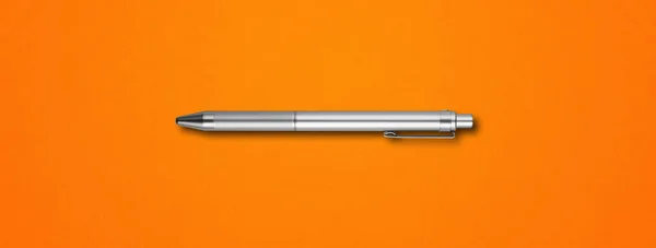 Steel metal pen isolated on orange background banner