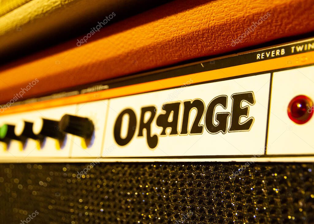 Paris - France -December 1, 2020 : Orange electric guitar amplifier close-up view