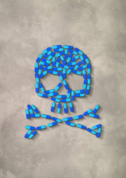 コンクリートの背景に隔離された青いカプセル薬で作られた頭蓋骨 3Dイラスト — ストック写真