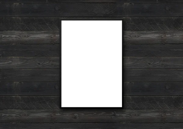 Black picture frame hanging on a black wooden wall. Blank mockup template