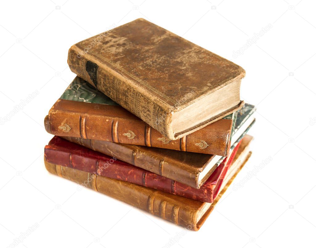 Stack of old books isolated on white background