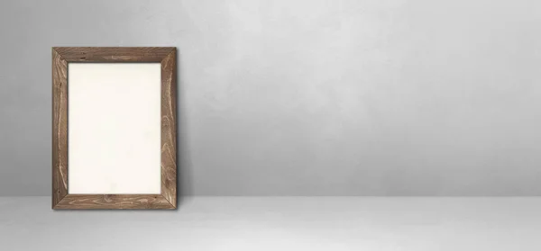 明るい灰色の壁にもたれている木製の画像フレーム ブランクモックアップテンプレート — ストック写真