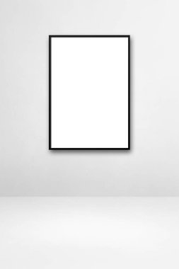 Beyaz bir duvarda asılı siyah bir çerçeve. Boş model şablonu