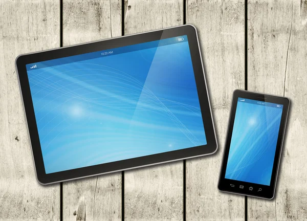 Smartphone und digitaler Tablet-PC auf einem weißen Holztisch — Stockfoto