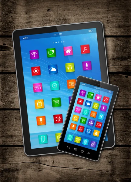 Smartphone and digital tablet PC with desktop icons on a dark wo — Stock Photo, Image