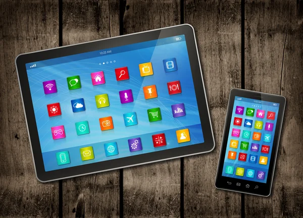 Smartphone and digital tablet PC with desktop icons on a dark wo — Stock Photo, Image