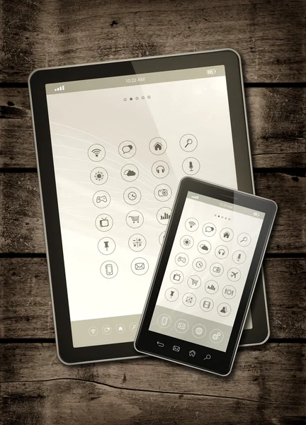 Smartphone och digital tablet Pc med Desktopen ikonen på en mörk wo — Stockfoto