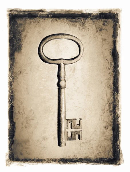 Old key in grunge frame — Stock Photo, Image