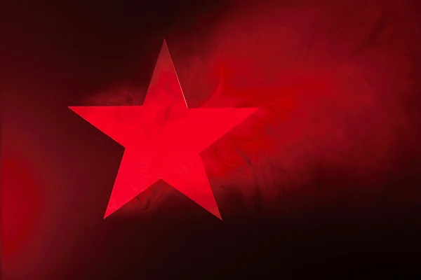 Красная звезда в дыму — стоковое фото
