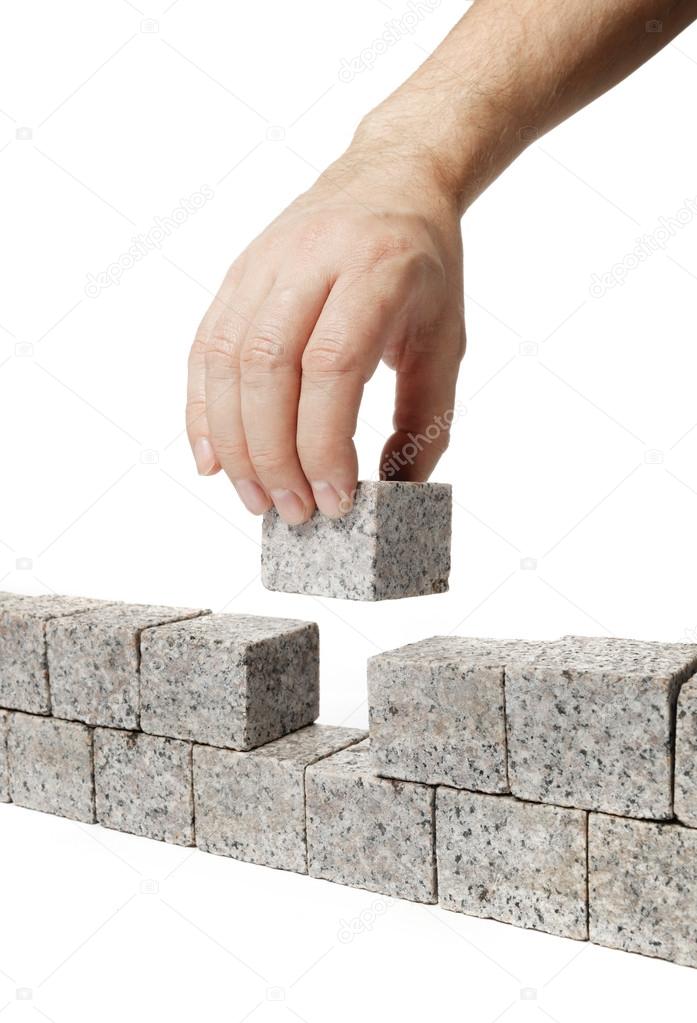 Man building Granite Wall
