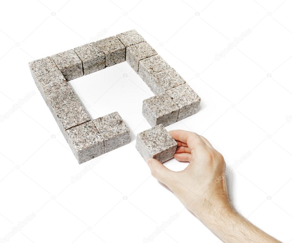 Man finishing a granite square