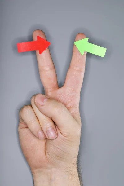 Arrows on fingers — Stock Photo, Image