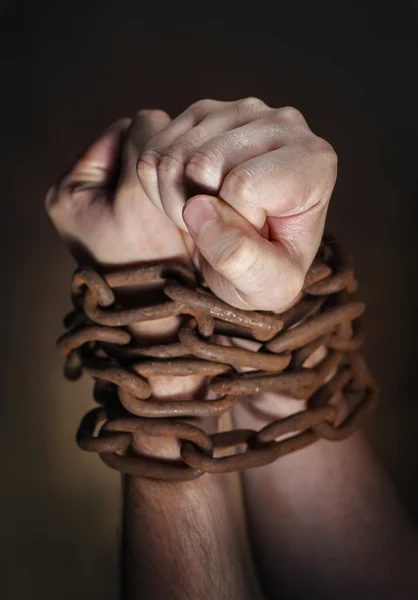 Hands with rusty chain — Stock Photo, Image