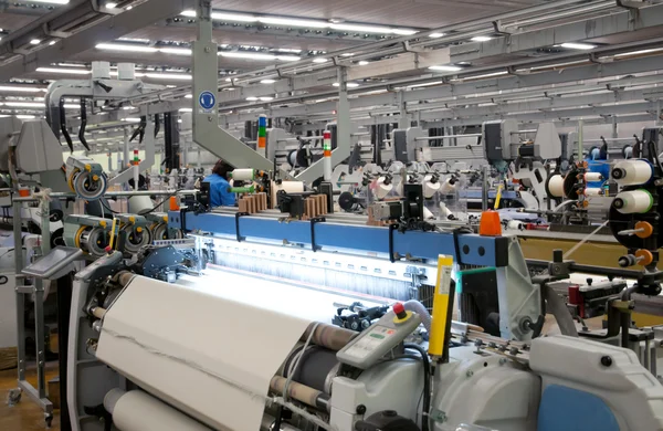 Textielindustrie - weven en verdraaiing Stockfoto
