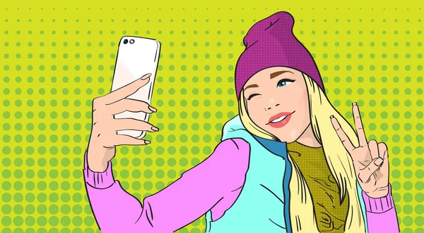 Chica tomando foto selfie en el teléfono inteligente Mostrar dos dedo gesto de la paz — Vector de stock