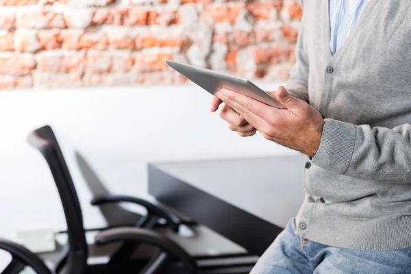 Person using tablet sitting office desk business man — Stock Photo, Image