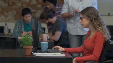 Woman typing computer, Business people office group sitting desk
