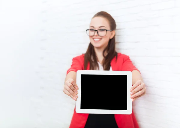 Businesswoman show tablet computer screen with empty copy space wear red jacket glasses happy smile — Stock Photo, Image