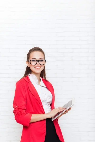 Businesswoman use tablet computer touch screen wear red jacket glasses happy smile