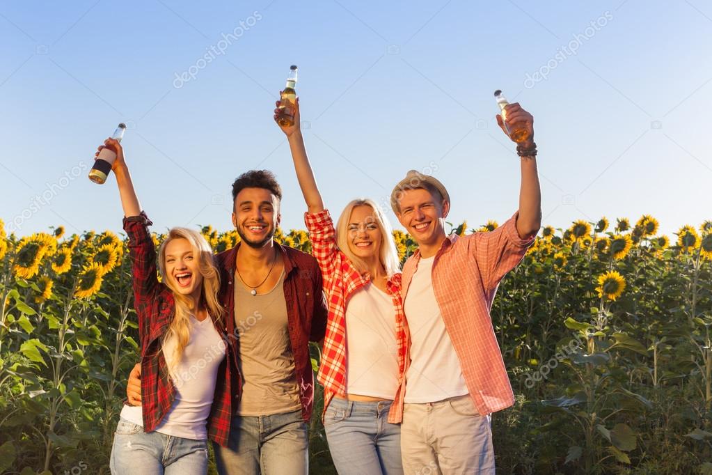 People drinking beer bottles group friends outdoor countryside