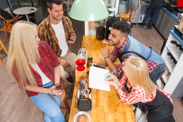 Barista serving clients give cup coffee shop bar counter