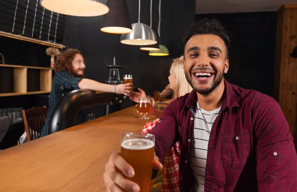 Young People Group In Bar, Hispanic Man Hold Glass Toasting Happy Smiling, Friends Sitting At Wooden Counter Pub — стокове фото